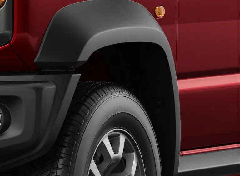 Scratch-resistant bumper with wheel arch extension